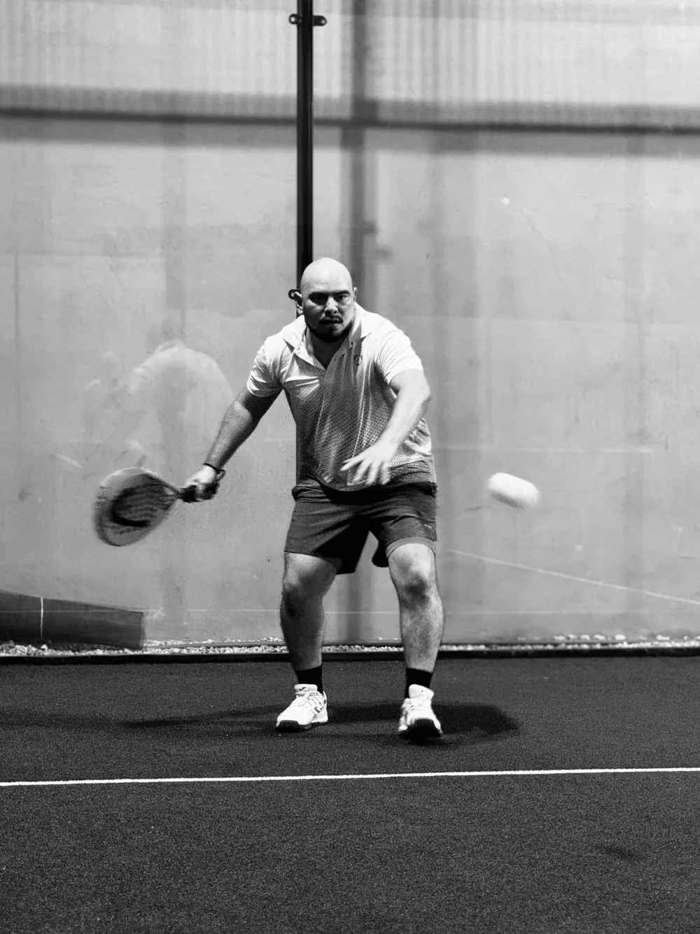 Padel players in action on court
